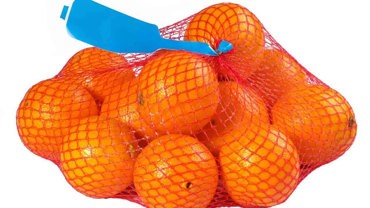 Naranjas, redes para frutas y verduras.
